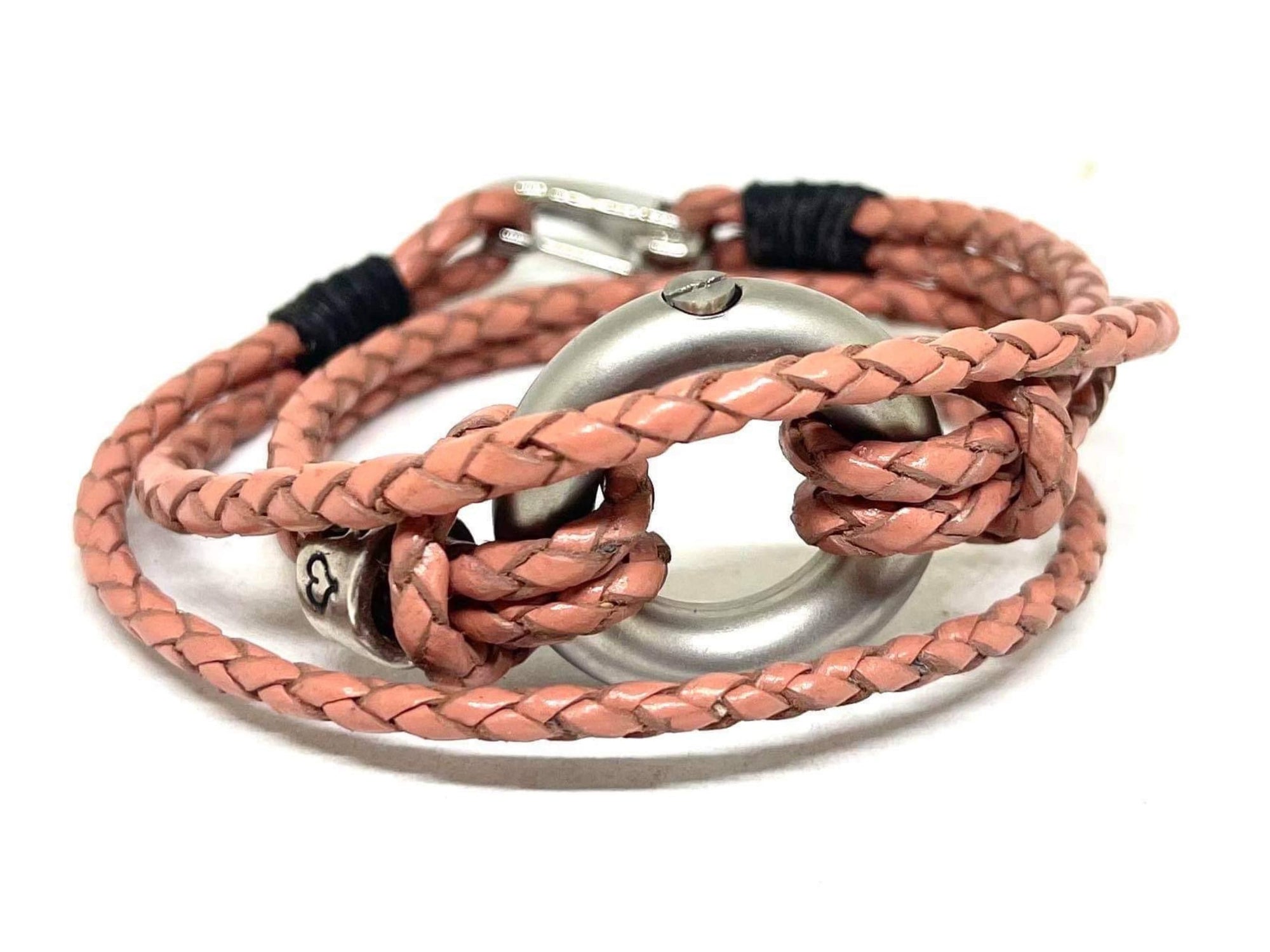 Pink braided leather bracelet, personalised with silver beads and a circular stainless steel urn.